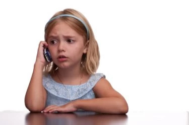 Sad girl on cell phone.