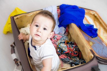 baby in suitcase