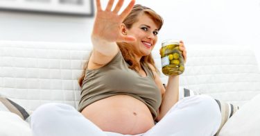 pregnant woman with pickle jar
