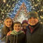 author and her kids at a holiday light show