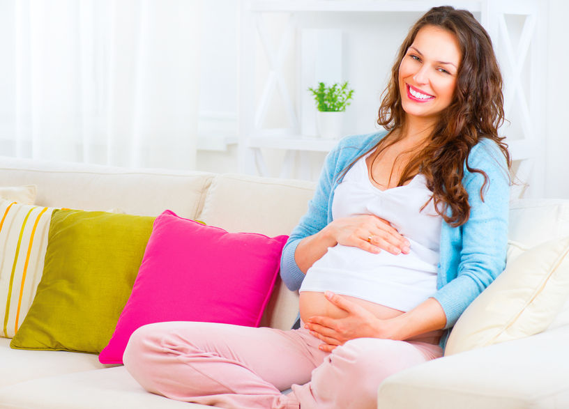 pregnant, woman, sitting, sofa, caressing bump, pregnancy