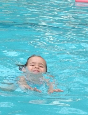 little girl swimming