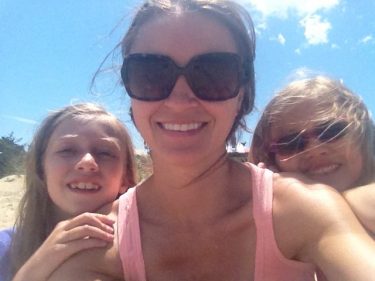 babysitter with kids at beach