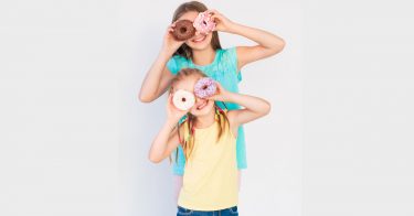 granddaughters with donuts