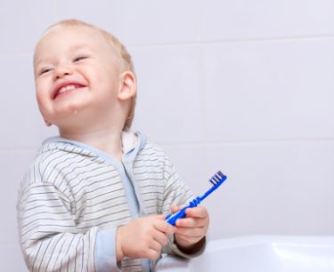 iStock_toddler with toothbrush