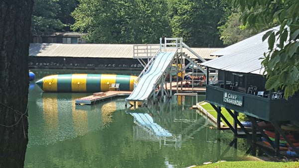 lake getaway at sleepover camp, bounce raft and water slide in the lake 