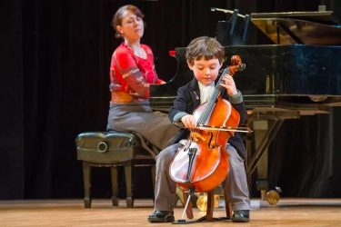 kid playing cello