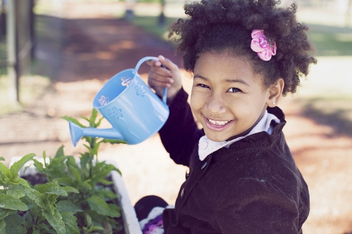 developmental activities, development, gardening, child happy plants outside blue smile green gardening
