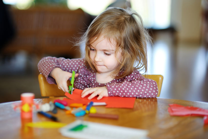 girl, daughter, preschool, scissors, paper, art, glue, red, brunette, polka dots, purple, mess, table, wood, chair
