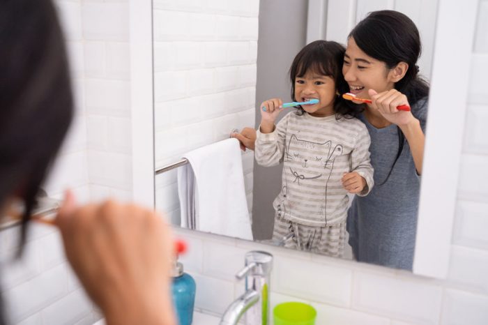 teeth, toothbrush, toothpaste, mom, daughter, sink, bathroom, water, brush, soap