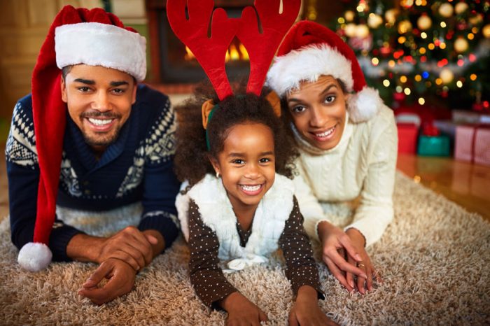 girl, dad, mom, sweater, tree, hat, santa, reindeer, christmas, tree, christmas tree, lights, rug, vest