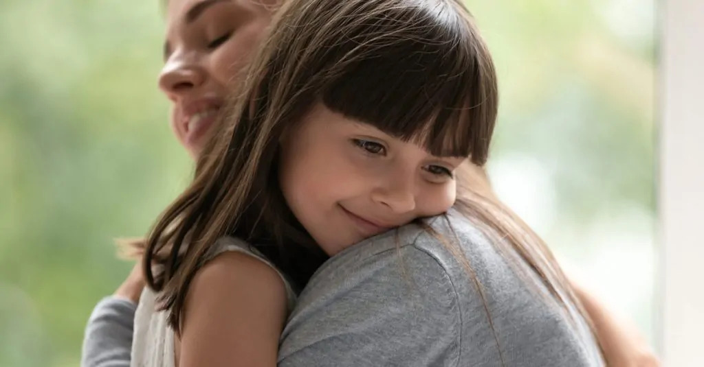 beloved nanny hugged by child