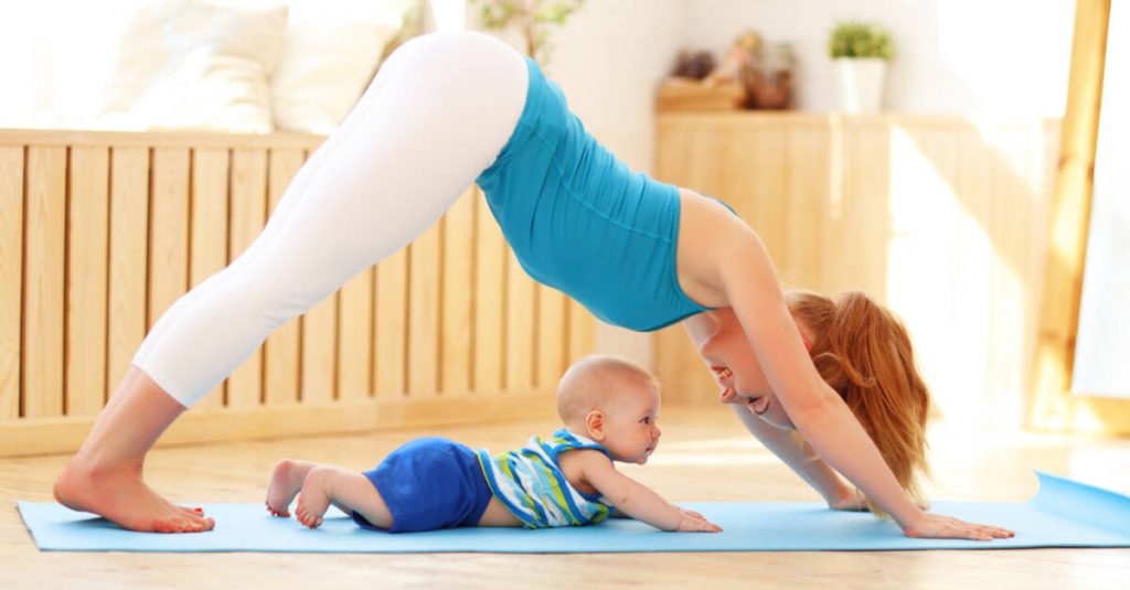 mom doing yoga with baby