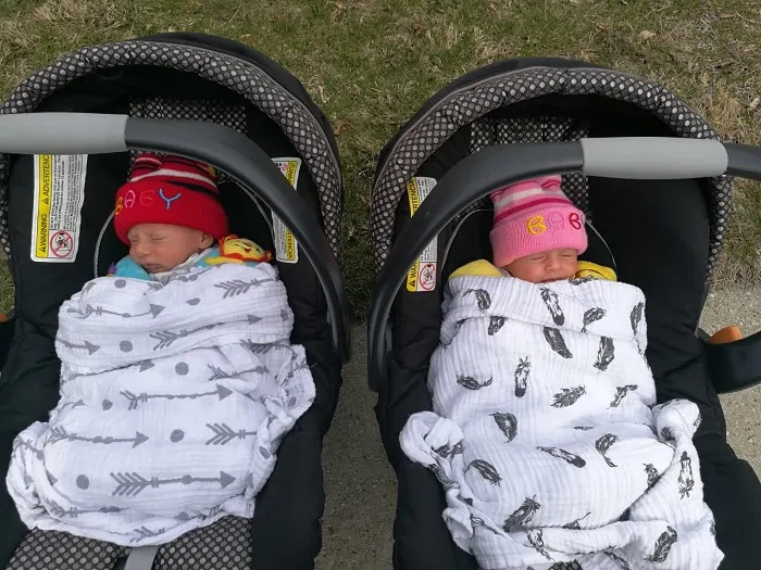 newborn twins in car seat