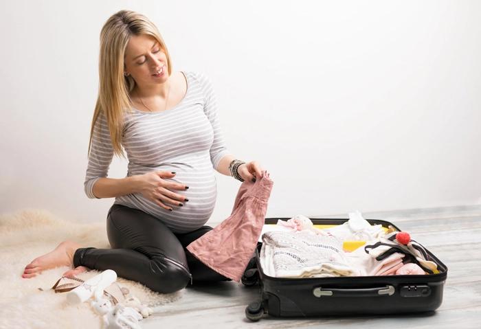 woman packing baby hospital bag