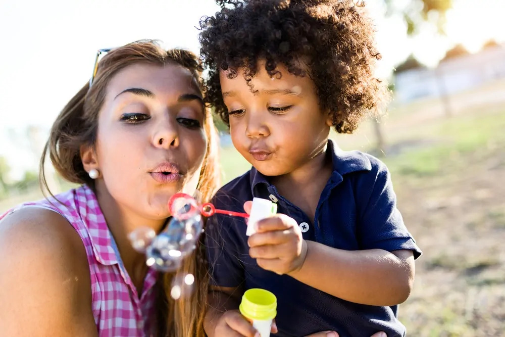 nanny and child having summer fun