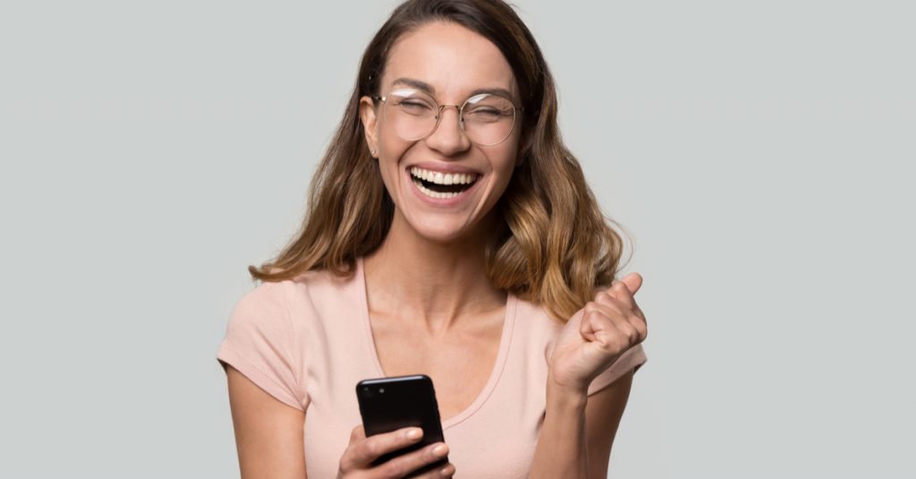 woman laughing at meme