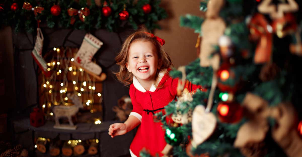 child going to open gifts on Christmas