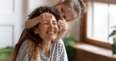 girl kissing her nanny