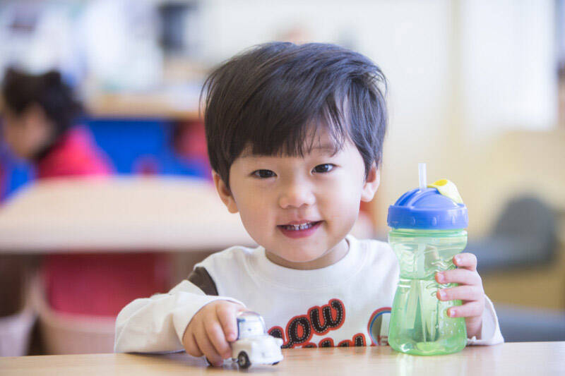 toddler with sippy cup