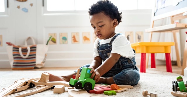 toddler playing with toys