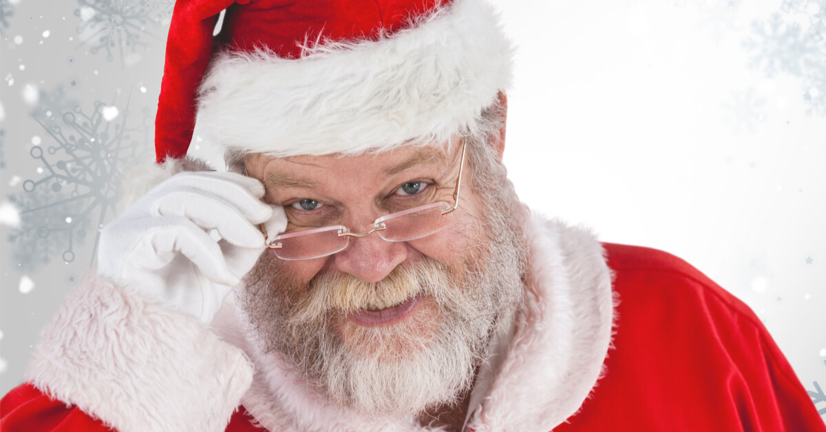 Santa tipping his eyeglasses 